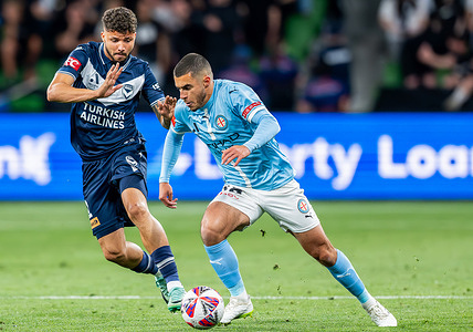 Melbourne City's Harry Politidis (R) and Melbourne Victory's Clarismario Santos (L) seen in action during the Men A-League 2024/25 Derby between Melbourne Victory and Melbourne City at AAMI Park. Final Score : Melbourne Victory 3 : 1 Melbourne City