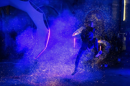 Vojta Stolbenko from the Czech Republic jumps through a curtain of sparks as he swings fire poi during his performance at the Ana Mraz 2025 winter street theatre festival in Ljubljana. Ana Mraz 2025 is an international winter street theatre festival in Ljubljana, Slovenia, held annually between Christmas and New Year, transforming public spaces into open-air stages. The 2025 edition runs from December 27 to 29 and features a new main venue at Krekov trg Square, with interactive street performances, circus and acrobatic acts, fire shows, and a snow playground with workshops for children. Organized by the Ana Monro Theatre, the free festival brings together local and international artists to animate the city’s streets and foster community through winter arts.