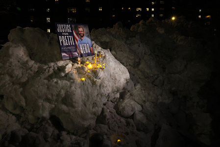 A makeshift memoriam on a mound of snow during a vigil in front of the VA Harbor Healthcare building. A nationwide vigil was held for Alex Pretti and for all of the victims of ICE and Border Patrol. Hundreds of nurses and federal workers gathered in remembrance in lower Manhattan.