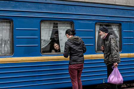 A train departing Odesa-Holovna station towards Uzhhorod. On April 23, Odesa was targeted by Russian missile attacks. The government has implemented war preparations all around the Odessa region, these include the installation of barricades and anti-tank obstacles. The Volunteer Center, previously a food market, is also now stocked with provisions.