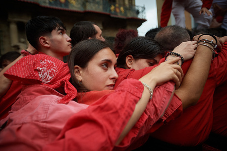 Members of the Colla Vella dels Xiquets de Valls, form “pinya” begin building the human tower, a tradition that dates back to the 15th century, during the exhibition. Members of the Colla Vella dels xiquets de Valls held an exhibition of their human towers in Pamplona, ​​Navarra, Spain.