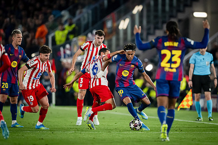 Lamine Yamal (FC Barcelona) and Koke (Atletico de Madrid) seen in action during a UEFA Champions League match between FC Barcelona and Atletico de Madrid at Spotify Camp Nou. Final Score: FC Barcelona 0 - Atletico de Madrid 2.