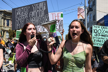 Pro-choice protestors chanting slogans through a megaphone. Pro-choice protests erupted in cities across the country when a leaked document revealed that the Supreme Court has drafted an opinion to overturn Roe Vs. Wade, which would make abortion after six-weeks illegal in many states.