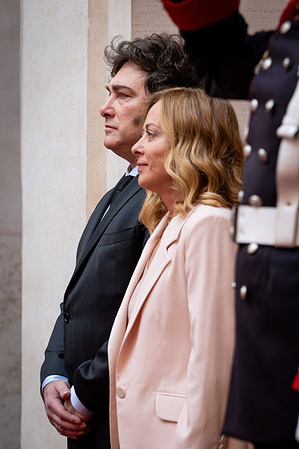 Italian Prime Minister Giorgia Meloni and the President of the Republic of Argentina Javier Milei review the honor guard at Palazzo Chigi.