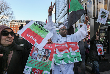 A protester marches along the Edgware Road chanting and wearing signs around his neck during the demonstration. Protesters marched through central London to celebrate the seventh anniversary of the Sudanese Revolution. Those demonstrating protested the current devastating war waged in Sudan by militias. They stood in solidarity with the Sudanese people suffering from that war, to expose the UAE’s role in financing the conflict, to end the violence against civilians, and they demanded greater international action to address the humanitarian crisis.