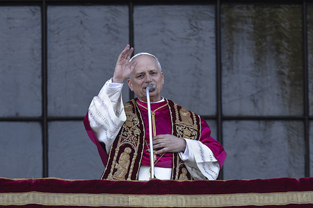 Pope Leo XIV greets the faithful from the central loggia of the Basilica of St. John Lateran in Rome, after presiding over a Mass and taking possession of the Roman Cathedra.