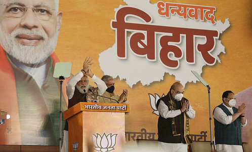 India's Prime Minister, Narendra Modi addressing supporters during a victory celebration for Bihar state assembly election and several by-elections in other states at the New Delhi BJP party's headquarters. The National Democratic Alliance (NDA) won an absolute Majority in Bihar with 125 seats out of 243 seats.