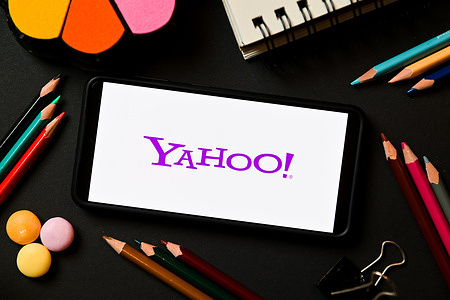In this photo illustration a Yahoo logo seen displayed on a smartphone.