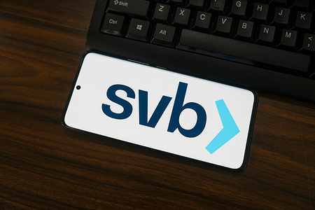 In this photo illustration, a Silicon Valley Bank (svb) logo is displayed on the screen of a smartphone.