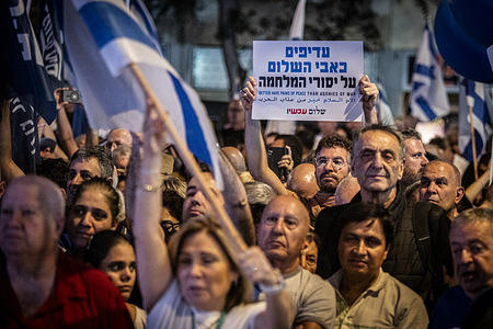 An Israeli man holds up a sign in support of peace during the Rabin memorial rally. Hundreds of thousands gathered in several rallies across Israel to mark 30 years since the assassination of prime minister Yitzhak Rabin. The main rally, whose turnout was reportedly around 150,000, was held at the Tel Aviv square where the Labor leader was assassinated on November 4, 1995, by right-wing extremist Yigal Amir after a peace rally.