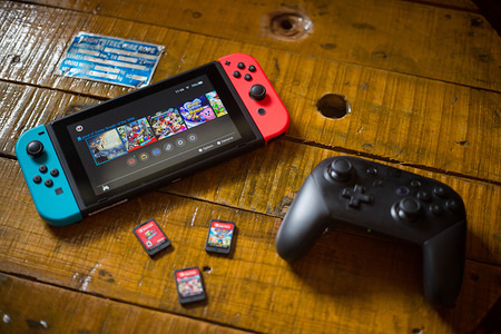 A turned on Nintendo Switch with 2 Joy-Con attached on it, a Pro Controller and 3 cartridge games.
The Kyoto based video game company Nintendo ended it’s comeback year with revenue worth $9 Billion after a glorious 2017 notably with the launch of the hybrid console the Nintendo Switch, mini retro vintage game consoles such as the Nintendo Entertainment System and Super Nintendo as well as its mobile phone video games.
Also Nintendo will welcome its new president Shuntaro Furukawa in the month of June 2018.