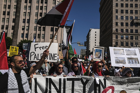 Crowds gathered at Pershing Square and marched through the streets of downtown Los Angeles to protest the humanitarian crisis caused by the ongoing siege of the Gaza Strip by Israel.