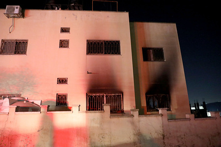 Palestinians inspect a burned-out house after the attack by Jewish settlers on the village of Deir al-Hatab, east of Nablus in the West Bank. The settlers attacked the homes of local residents in Deir al-Hatab after the funeral of the Jewish shepherd killed south of Jenin. The Israeli army claims that Palestinians were responsible for the death.