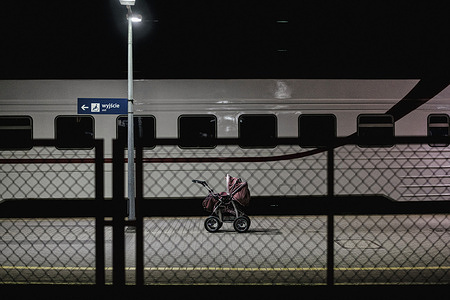 A baby's stroller was left on the platform of Przemyśl train station in East Poland. Locals have been leaving strollers as donations for arriving mothers who have had to abandon much of their belongings while fleeing their homes in Ukraine after the Russian invasion. Displaced Ukrainians fleeing the war arrive at the Polish border crossing at Medyka before being transit to Przemyśl railway station for onward trains to Krakow and beyond. An estimated 2 million refugees have entered Poland alone.