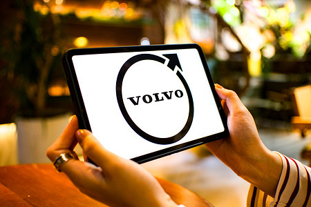 In this photo illustration, the Volvo logo is seen displayed on a tablet screen.