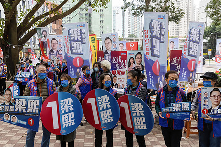Election campaign members of pro-China candidate Edward Leung Hei hold signs during a rally in Siu Sai Wan.The 2021 Legislative Council General Election has been held on December 19, with a 30.2 per cent turnout rate in the election, the lowest since 1997 as pro-China or pro-establishment candidates won a sweeping victory. This is the first major election for the legislative council since the electoral system reformation, a major crackdown on pro-democratic parties and the establishment of Hong Kong National Security Law, with the introduction of the Candidate Eligibility Review Committee to ensure that only patriotic candidates are allowed under the Beijing overhaul.