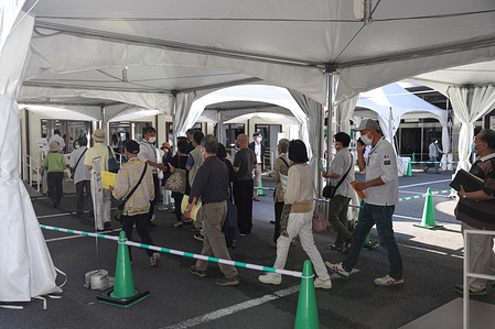 Visitors walk to the waiting tent at the vaccination centre.
Opened on May 24, 2021, the mass vaccination center in Otemachi is run by the Self-Defense forces and 10,000 people can be vaccinated in one day.