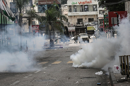 Israeli soldiers fire live ammunition and tear gas at Palestinians in the old city. Israeli forces launched a military operation in the old city raiding homes and arresting dozens of Palestinian youths. Stone-throwing erupted around the old city and dozens were injured during the clashes.