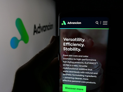 In this photo illustration, a smartphone with the web page of US chemical company Advancion Corporation is seen on screen in front of logo.