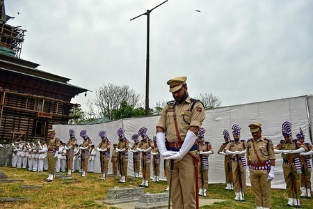 Jammu and Kashmir policemen pay tribute next to the graves at the Martyr's Graveyard in Srinagar, Kashmir.
July 13 is observed as Martyrs' Day to pay homage to the 22 civilians killed in firing by Dogra Army outside Srinagar Central Jail in 1931.