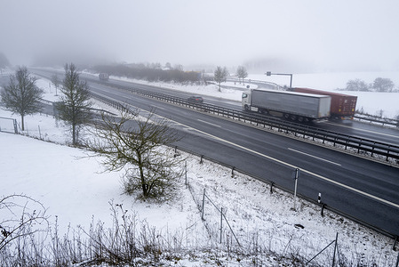 A view of vehicles moving on the autobahn road during a foggy day. Much of Bavaria is covered in dense fog and snow today and although there has been a thaw the conditions are making life difficult for people going about their daily life in particular those who have to travel.