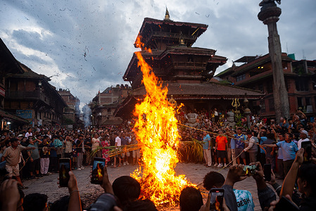 Devotees burn a straw effigy of Ghantakarna during the celebration. Ghantakarna festival is a celebration of the defeat of the mythical demon Ghantakarna, chasing the evil spirits and bringing good fortunes.