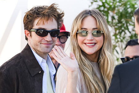 Actor Robert Pattinson and American actress Jennifer Lawrence, seen arriving at the photocall of Die My Love during the 78th Festival de Cannes.
