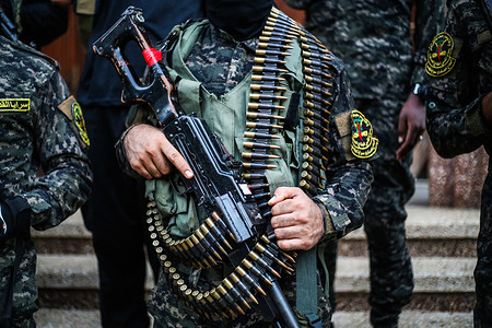 Palestinian fighter from Saraya Al-Quds stands at a military march to celebrate the escape of the six Palestinian prisoners from the Israeli prison of "Gilboa" two days ago in Dair Al-Balah refugee camp central Gaza strip.