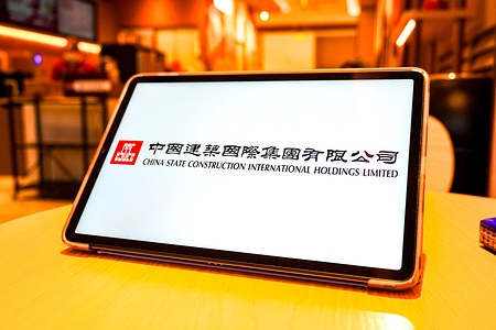In this photo illustration, the China State Construction International Holdings logo is displayed on the screen of a smart tablet.