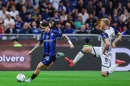 (L-R) Nicola Zalewski of FC Internazionale seen in action with Nicolas Valentini of Hellas Verona FC during Serie A 2024/25 football match between FC Internazionale and Hellas Verona FC at San Siro Stadium. Final Score FC Internazionale 1 : 0 Hellas Verona FC