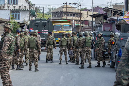Indian paramilitary soldiers cordon off the area after an unknown aircraft crashed in Wuyan near Indian-administered Kashmir's main city of Srinagar. India fired missiles at Pakistani territory early on May 7, killing at least eight people, according to Pakistan, which said it had begun retaliating in a major escalation between the nuclear-armed rivals.