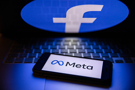 In this photo illustration, a Meta logo is displayed on the smartphone screen.