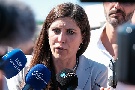 Chiara Appendino, Member of Parliament and vice president of the Five Star Movement, during a meeting with workers and trade union representatives outside the Stellantis plant. The former mayor of Turin listened to employees under solidarity contracts and denounced the stalemate on the Gigafactory project, accusing the government of failing to take responsibility for the automotive sector crisis.