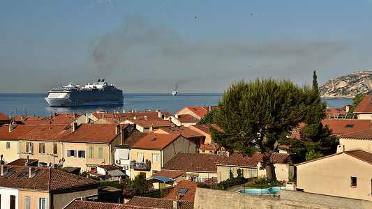 General view of the Wonder Of The Seas blocked in PACA, Marseille. Activists from the Stop Cruises collective blocked the arrival of the largest liner in the world, the Wonder of the seas, in the port of Marseille by canoe-kayak.