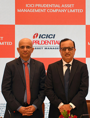 L-R Nimesh Shah, Managing Director (MD) and Chief Executive Officer (CEO), ICICI Prudential Asset Management Company Limited and Sandeep Batra, Chairman, ICICI Prudential Asset Management Company Limited pose for a photo after a press conference to announce its Initial Public Offer (IPO) in Mumbai. The Initial Public Offer (IPO) will open on 12th December and will close on 16th December 2025 with a price band fixed at Rs.2,061/- (USD 22.86) to Rs.2,165/- (USD 24.01) per equity share.