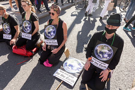 Protesters seen sitting on the Streets while holding placards during the demonstration.
On the 3rd day of Extinction Rebellion's protests, protesters came together with the aim of demanding climate justice for the Indigenous people of Amazon rainforests in Brazil. They protest against ecocide and deforestation in Brazil. The group began their demonstration outside Brazilian Embassy in London, then moved over to Piccadilly Circus, and lastly occupying Oxford Circus.