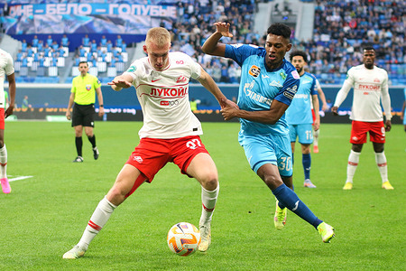 Daniil Denisov (No.97) (L) of Spartak and Mateo Cassierra Cabezas, commonly known as Mateo Cassierra (No.30) (R) of Zenit in action during the Russian Premier League football match between Zenit Saint Petersburg and Spartak Moscow at Gazprom Arena. Zenit FC team won against Spartak with a final score of 3:2. Zenit St. Petersburg will remain at the top of the Russian Premier League.