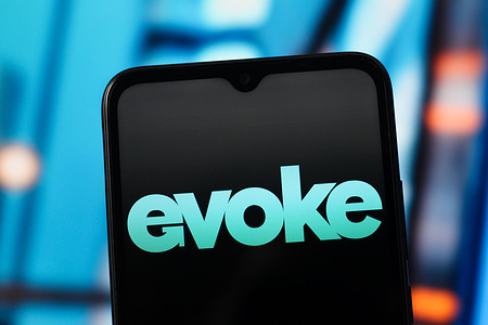 In this photo illustration, the Evoke PLC logo is seen displayed on a smartphone screen.