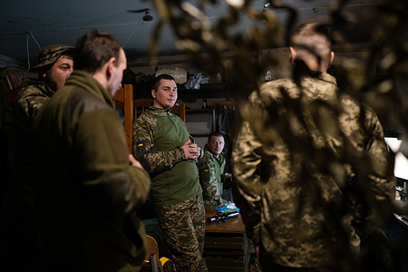 Ukrainian soldiers are seen discussing in the base near Soledar. The eastern Ukrainian town in Donetsk region has been sieged by Russian armed force in January. The siege has provided advantage on the encirclement of nearby city, Bakhmut, which is seen as one of the most significant battle since the Russian invasion. As the Ukrainians are preparing for the long-awaited counteroffensive, the battle to regain control in Soledar and its surrounding area will be significant to Ukrainian army.