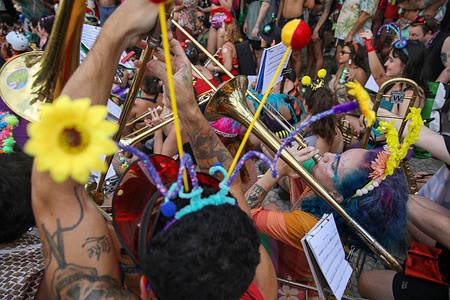 Musicians play trumpets in a carnival bloco in Rio de Janeiro. The carnival block “Marimbondo Não respeita” paraded through the streets of downtown Rio de Janeiro during the street carnival. In Rio de Janeiro, Brazil, before the official carnival kicks off from February 13 to 18, the pre-carnival celebrations are already underway.