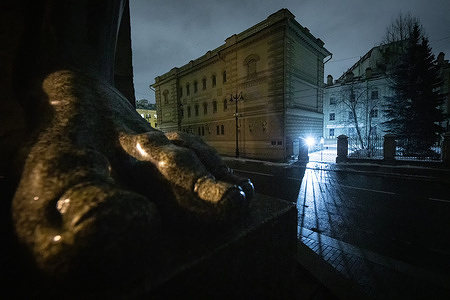 Sculptural group "Atlanta" at the entrance of the State Hermitage Museum on Millionnaya Street late in St. Petersburg