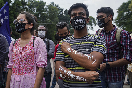 A protester with his hands and face mask written on with anti rape inscriptions, during the demonstration.
Bangladesh Student Union activists stage a demonstration in front of Home Ministry against rape and police harassment.