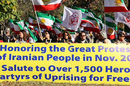 Demonstrators hold a large banner honoring the 1,500 martyrs of the November 2019 uprising in Iran, commemorating their fight for freedom during the rally.. Demonstrators gathered in Washington DC to pay tribute to the 1,500 protesters killed during the November 2019 uprising in Iran.