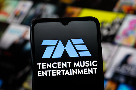In this photo illustration, the Tencent Music Entertainment Group (TME) logo is seen displayed on a smartphone screen.