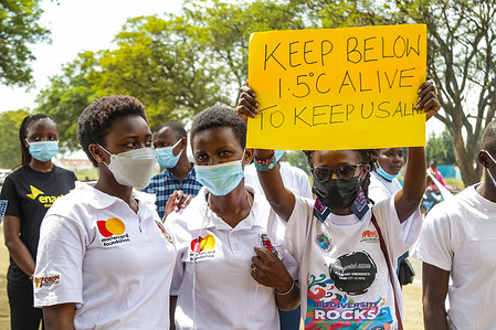 A climate activist holds a placard expressing her opinion during the Fridays for Future event. Climate activists in Nakuru joined others worldwide in a Fridays For Future protest and tree planting. They also educated pupils of a local school on the impact of climate change.