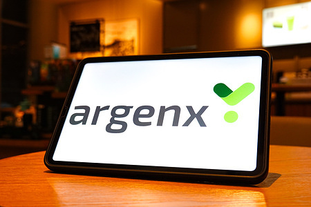 In this photo illustration, the argenx logo is seen displayed on the screen of a tablet.