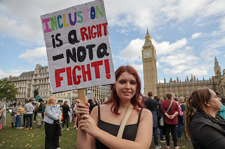 A woman holds a placard during the special educational needs and disabilities (SEND) rally in Parliament Square. The demonstration comes as MPs begin debating a petition calling for improved SEND support and the protection of legal rights. The campaign demands 'the same, ordinary things that other children and families take for granted.
