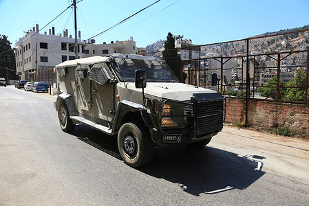 An Israeli military vehicle seen leaving after an Israeli military operation in the village of Salem in West Bank. Israeli forces raided and searched a residential building in the Jabal Zabla neighborhood of Nablus. Residents reported that the army arrested a woman and a young man from the building. The army also raided the village of Salem, east of Nablus, and arrested a Palestinian man in his twenties during the operation.
