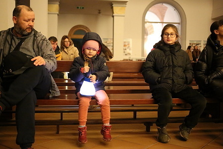 A girl with a lantern seen inside St. Paul's Lutheran Church after the procession. St. Martin's Eve was held at St. Paul's Lutheran Church. A lantern procession for children took place on this occasion. St. Martin's Day is an international holiday commemorating the memory of Bishop Martin of Tours. It is celebrated annually on November 11 in many countries, primarily Catholic.