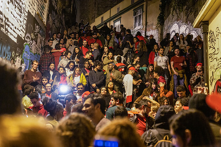 People are seen celebrating Lula da Silva's victory in the presidential elections to the sound of samba music. Hundreds of people gathering at Ferro Bar, Porto, to celebrate Lula da SIlva's victory in the presidential elections.